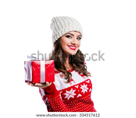 Beautiful young woman in red sweater. Studio shot on white background.