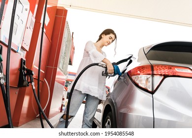 Beautiful Young Woman Refuel The Car