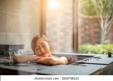 Beautiful Young Woman Relaxing  In Hot Spring