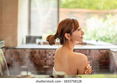 Beautiful Young Woman Relaxing  In Hot Spring