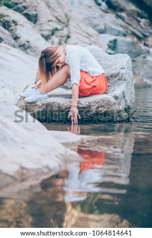 Beautiful young woman relaxing in the nauture on the spring day