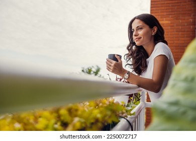 beautiful young woman relaxing over a cup of tea - Powered by Shutterstock