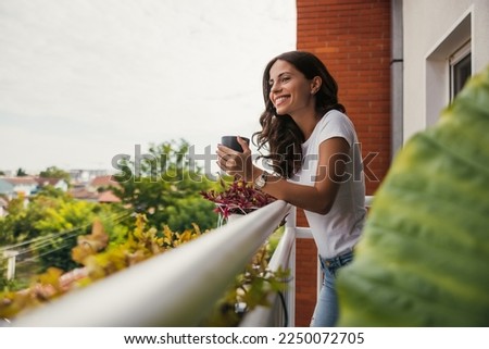 beautiful young woman relaxing over a cup of tea Stock foto © 