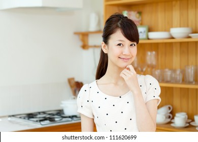 Beautiful young woman relaxing in the room. Portrait of asian. - Shutterstock ID 111620699