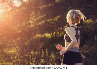 A Beautiful Young Woman Is Running In The Country Side