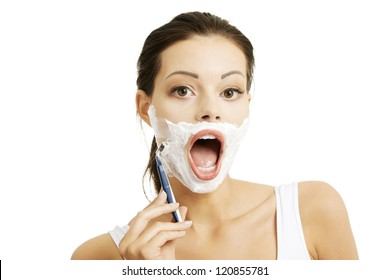 Beautiful Young Woman Shaving Her Face With A Razor