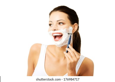 Beautiful Young Woman Shaving Her Face With A Razor