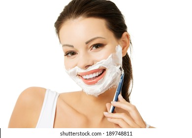 Beautiful Young Woman Shaving Her Face With A Razor 