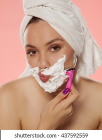 Beautiful Young Woman Shaving Her Face With Foam And Razor