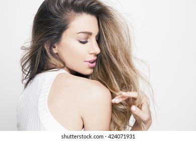 Beautiful Young Woman With Shiny Hair And Bright Makeup. Lifestyle And Cosmetics Concept. Studio Shot, Horizontal.