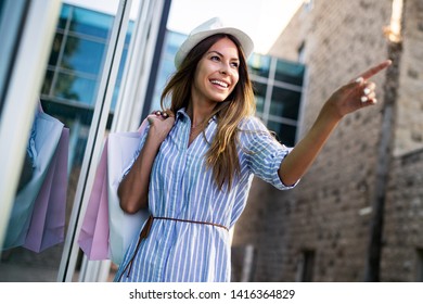 Beautiful young woman shopping and traveling on summer - Shutterstock ID 1416364829