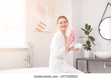 Beautiful Young Woman With Shower Gel In Bathroom