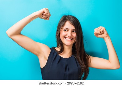 Beautiful Young Woman Showing Arm Muscles