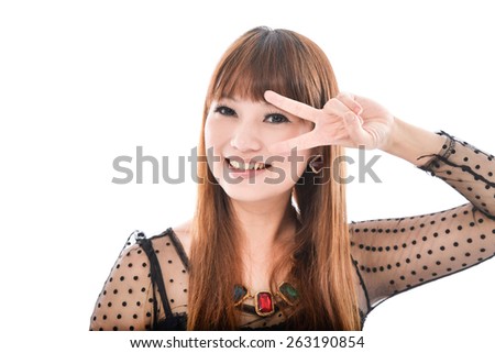 beautiful young woman showing two fingers or victory gesture
