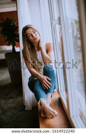 Similar – Blonde young caucasian woman smiling on steps