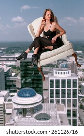 Beautiful Young Woman Sitting In A Queen Anne Style Chair