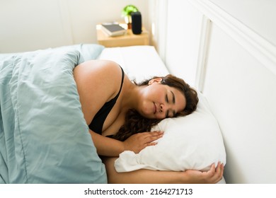 Beautiful Young Woman Sleeping Peacefully In Her Bed. Fat Woman In Her 20s Taking A Nap In The Bedroom