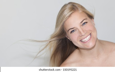 Beautiful young woman smiling - Shutterstock ID 150195221