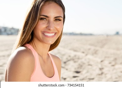 Beautiful Young Woman Smiling At The Beach In California.