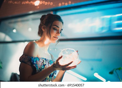 Beautiful Young Woman Smiling And Talking Garlands Of Lights At City