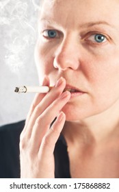 Beautiful Young Woman Smoking Cigarette, Close Up Portrait.