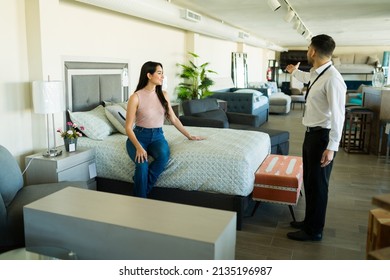 Beautiful Young Woman Speaking With A Male Sales Representative To Buy New Furniture Bedroom