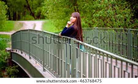 Similar – Beautiful young woman smiling and walking happy on the park outdoors