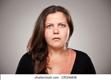 Beautiful Young Woman In Studio Looking At Camera/Portrait Of A Normal Young Woman