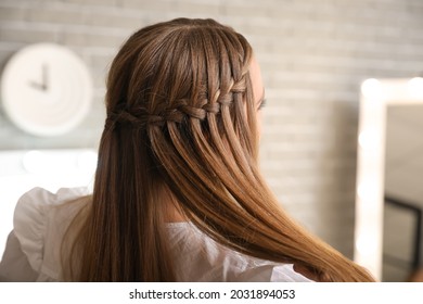 Beautiful young woman with stylish hairdo at home