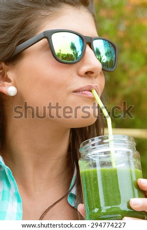 Similar – Image, Stock Photo Woman with sunglasses drinking green vegetable smoothie outdoors