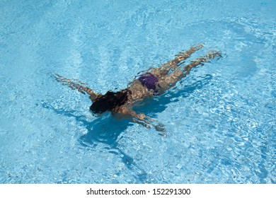 Beautiful Young Woman Swiming Under The Water