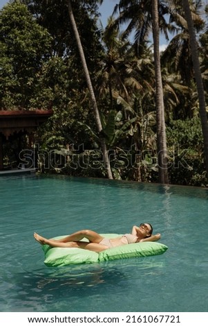 Similar – Rückansicht einer blonden Frau  im Infinity Pool