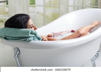 Beautiful Young Woman Takes Milk Bath