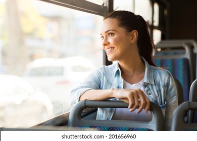 beautiful young woman taking bus to work - Powered by Shutterstock