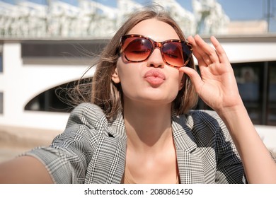 Beautiful Young Woman Taking Selfie On Quay