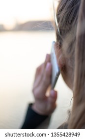 The Beautiful Young Woman is Talking by Phone with View on the City. Shallow Depth of Field. Selective Focus. - Shutterstock ID 1355428949