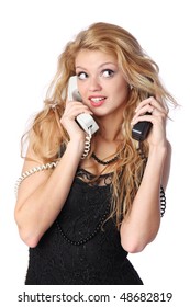 Beautiful Young Woman Talking On Two Phones At Once.