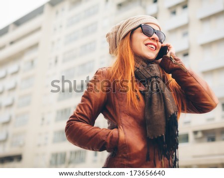 Beautiful young woman talking on the phone