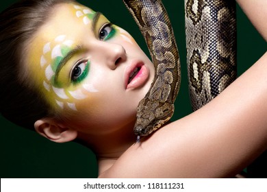Beautiful young Woman Tamer with a Snake (Python) - Circus Performance