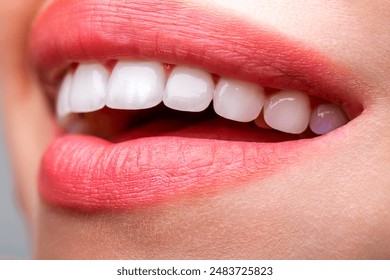 Beautiful young woman teeth. Teeth whitening. Dental health concept. Teeth whitening procedure. Dental care. Dentistry concept. Perfect healthy teeth. Closeup shot of woman's toothy smile. - Powered by Shutterstock