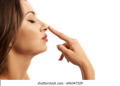 Beautiful Young Woman Touching Her Nose