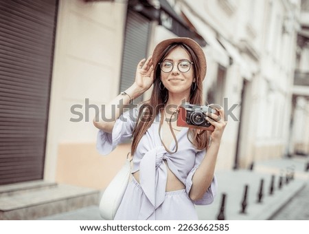 Similar – Long hair girl with hat and sunglasses walking in Sydney city streets in Australia.