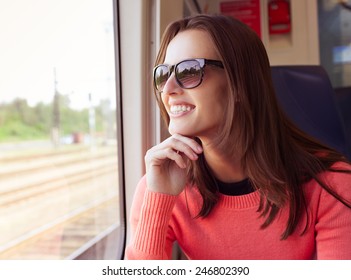 Beautiful Young Woman Traveling By Train