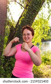 Beautiful Young Woman Trying To Get Fit For Summer; Boxing Work Out In A Park In The Shadow