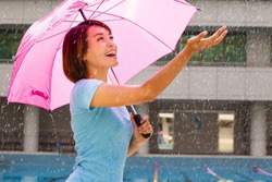 Beautiful Young Woman Under Pink Umbrella