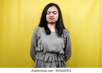 Beautiful young woman unhappy, pouting, feeling annoyed, isolated