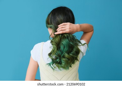 Beautiful Young Woman With Unusual Green Hair On Color Background