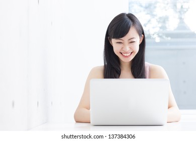 beautiful young woman using laptop computer