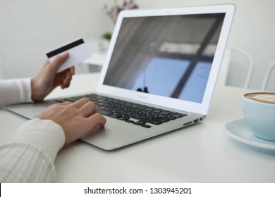 Beautiful Young Woman Using Portable Laptop Computer While . Young Beautiful Girl Using A Personal Laptop Computer To Bill Pay On The Internet.