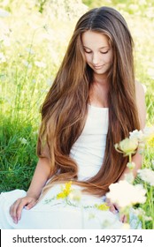 Beautiful Young Woman with very Long Hair Outdoors. Hair Care, Hair style, Beauty and Fashion